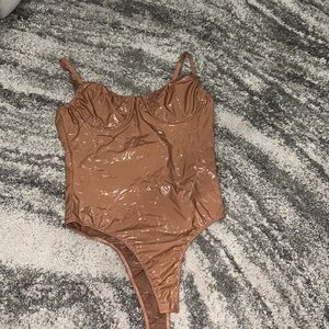 Nude latex bodysuit